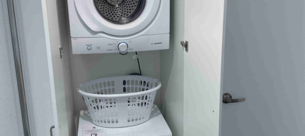 Washing machine, dryer and washing basket in laundry of one bedroom apartments