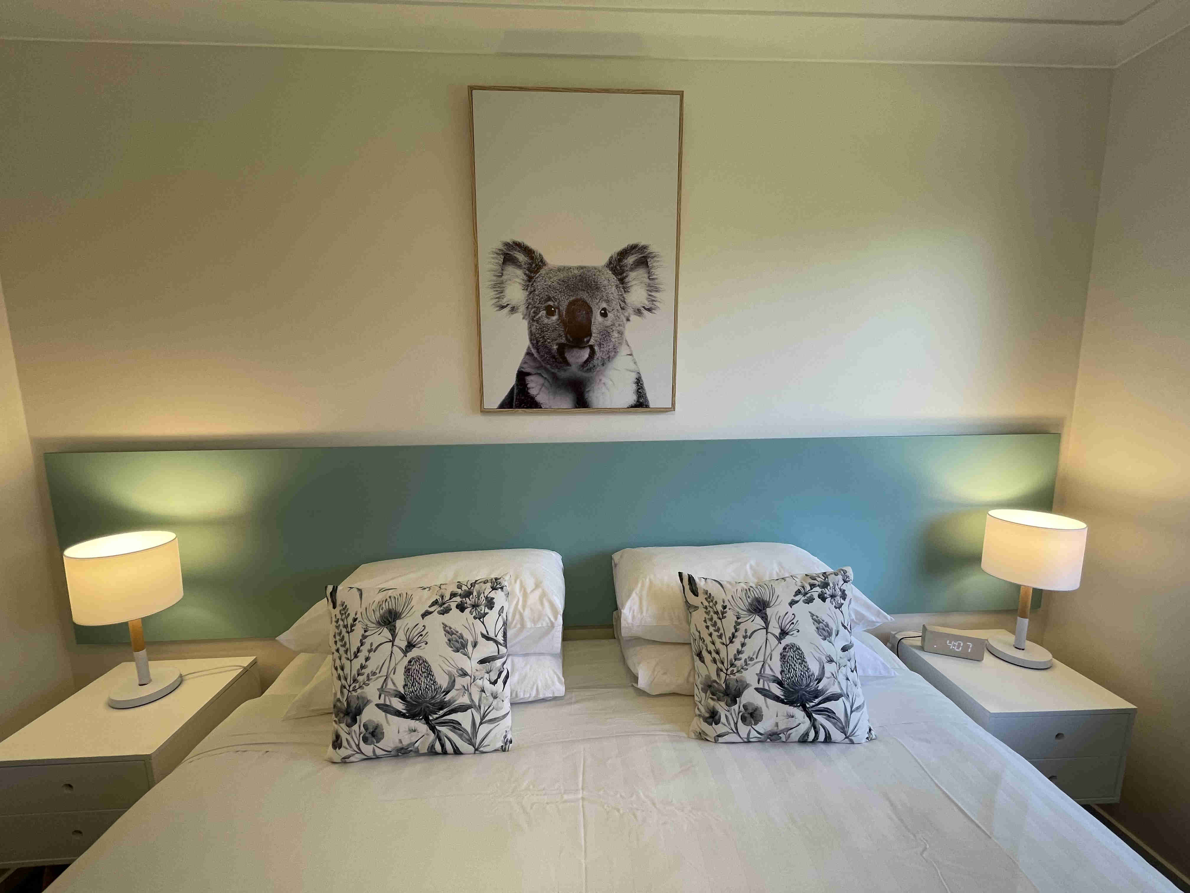 Bed with canvas of koala in all apartments