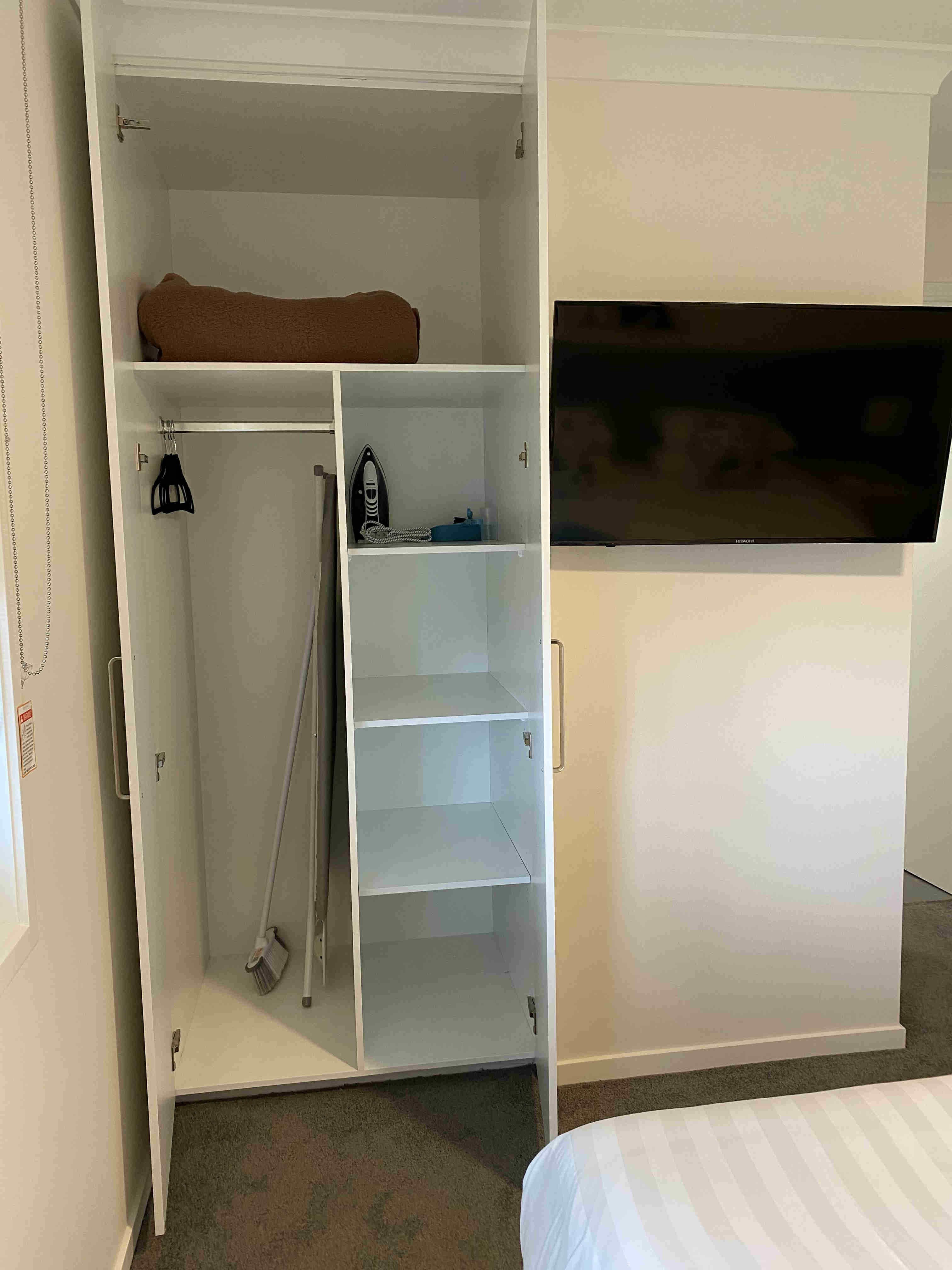 Wardrobe and smart tv in one bedroom apartments