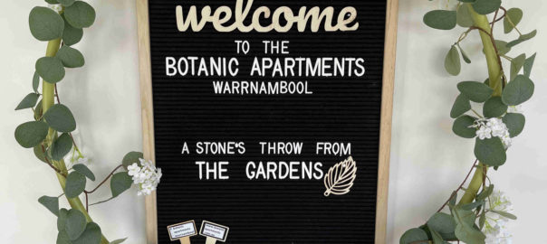 Welcome sign in reception entrance at Botanic Apartments, Warrnambool