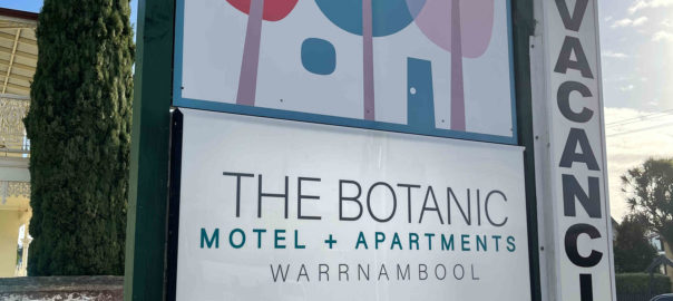 Exterior sign at front of property of the botanic motel and apartments